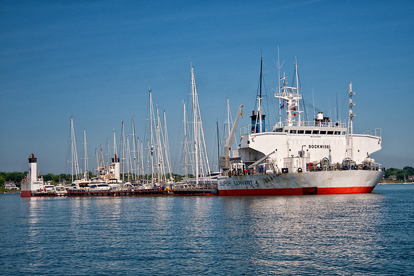 Super Servant 4 delivering yachts to Newport, Rhode Island, anchored in the east Passage of Narragansett Bay.